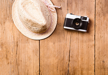 Summer vacation composition. Camera and hat. Studio shot