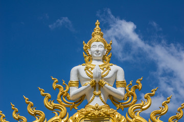 Fototapeta premium White Angel Buddha statue on the Wat wall thailand