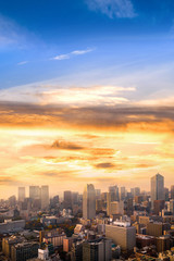 Fototapeta premium Cityscape of Tokyo, city aerial skyscraper view of office building and downtown of tokyo with sunset / sun rise background. Japan, Asia