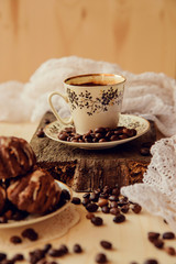 Vanilla muffins with fresh coffee for breakfast on a black background