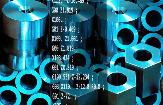 Cnc programming concept. Various metal pieces produced by program written in G-code.