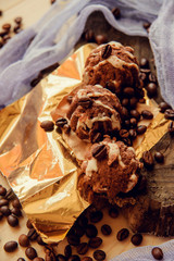 Chocolate cupcakes with coffee beans on dark background, AF point selection.