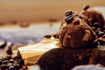 Chocolate cupcakes with coffee beans on dark background, AF point selection.