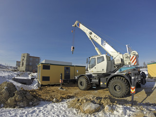 Mobile crane in work at a construction site