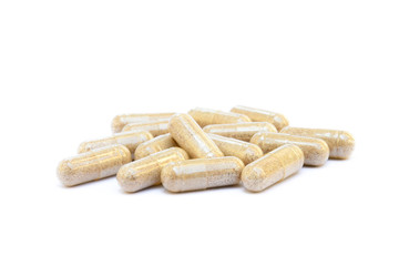 Natural medicine capsules isolated on a white background
