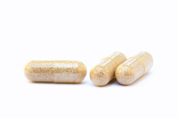 Natural medicine capsules isolated on a white background