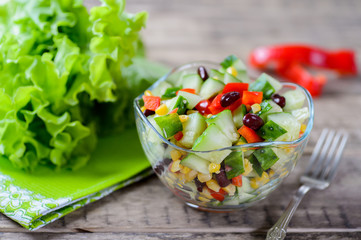 Vegetable salad with sweet pepper, cucumbers and haricot