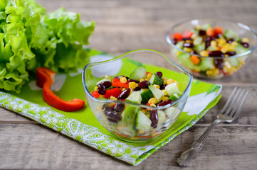 Fresh spring salad with sweet pepper, cucumbers and haricot