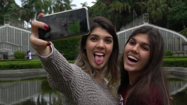 Sisters taking a selfie in Jardim Botanico - Botanic Garden - Sao Paulo, Brazil