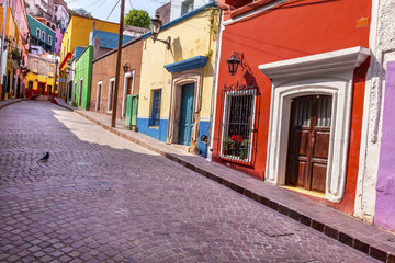 Fototapeta na wymiar Red Pink Colorful Houses Narrow Street Guanajuato Mexico