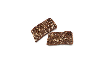 Black bread with seeds on white background
