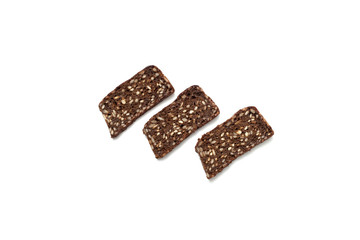 Black bread with seeds on white background
