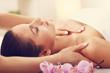Fototapeta na wymiar Beautiful woman getting massage in spa