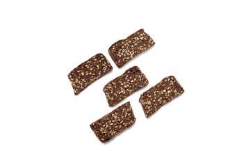 Black bread with seeds on white background
