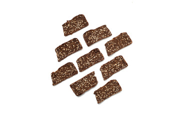 Black bread with seeds on white background

