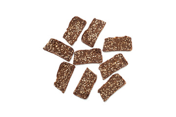 Black bread with seeds on white background
