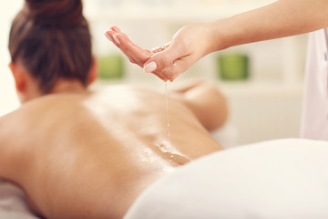 Beautiful woman getting massage in spa
