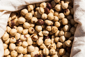 Hazel nuts in cloth bag on display for sale