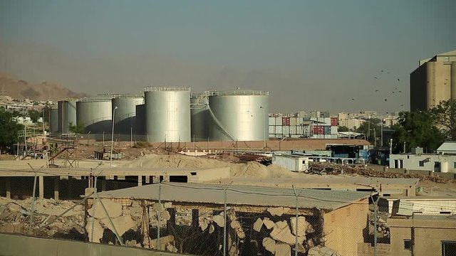 Large capacity tanks in Aqaba city, Jordan. Industrial objects near port terminal in Aqaba, Hashemite Kingdom of Jordan