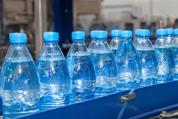 conveyor for bottling water from plastic bottles