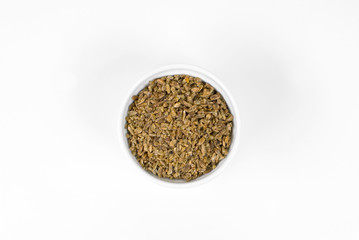Freekeh in a ramekin in white background seen from above