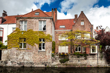 Architecture of Bruges city, traditional houses view on the canal