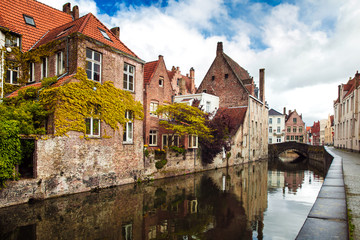Architecture of Bruges city, traditional houses view on the canal