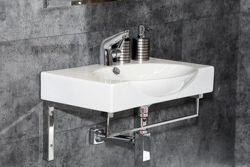 Modern white sink in bathroom interior close up view