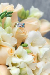 Wedding rings with bouque