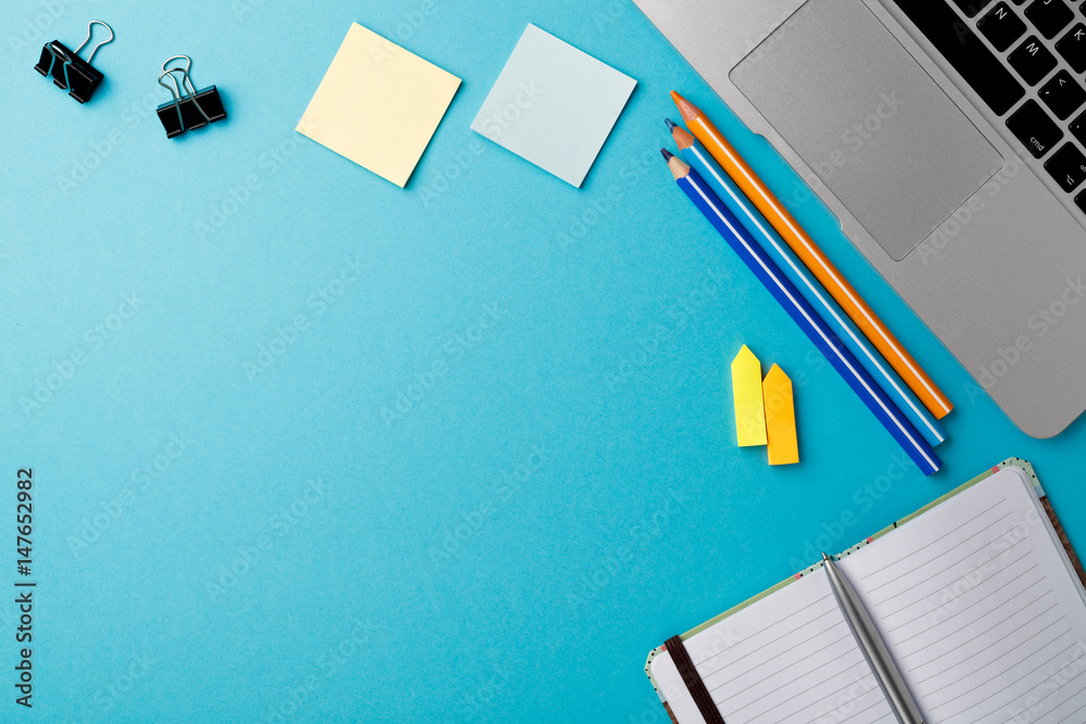 Aufkleber start of morning work office desk with computer laptop pencil sheet paper notebook pen blue texture 