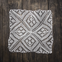 Crocheted Doily on wooden table