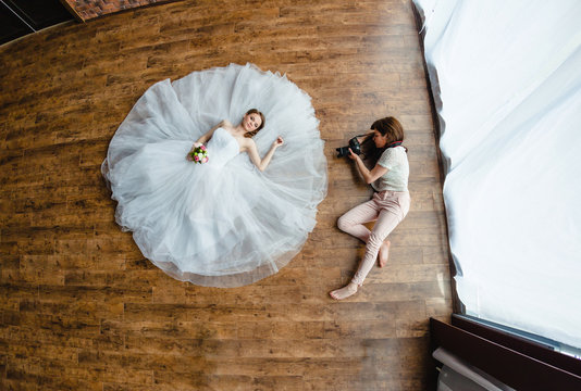 Photographer is taking pictures the bride