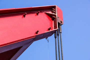 Detail of the top of a red mobile crane.