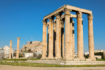 Fototapeta premium Temple of Olympian Zeus and Acropolis Hill, Athens, Greece.