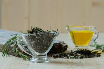 Olive oil with rosemary in a glass jug
