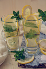 non-alcoholic or alcoholic Mojito Cocktail with lemon and mint