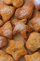 Cookies of different shapes with sugar for a Golden crust.