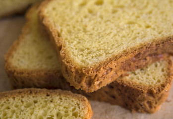 Home-made butter cake sliced on a wooden board. Natural light.