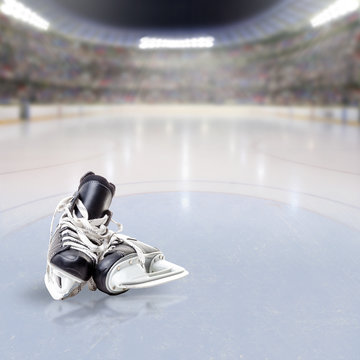 Hockey Skates on Ice of Crowded Arena