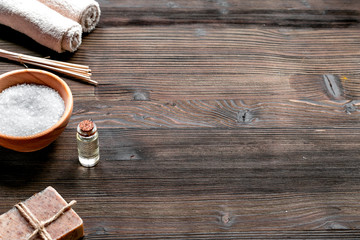 Obraz na płótnie Canvas Aromatherapy SPA set with salt and natural oil wooden background mock up