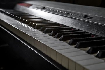 piano on wooden background closeup