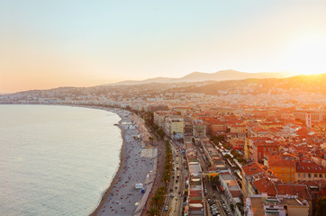 cityscape of Nice with beach and sea at sunset, French Riviera, France