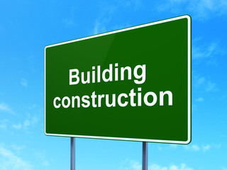 Constructing concept: Building Construction on road sign background