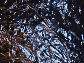 Crumpled shiny leaf of foil