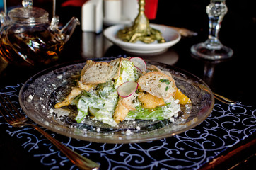 Author's Caesar salad in beautiful vintage dishes