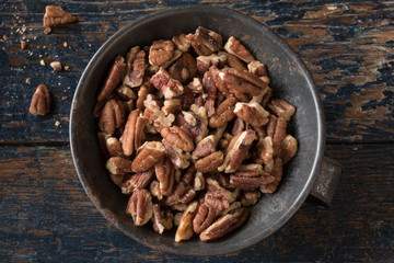 Chopped Pecans in a Tin Bowl