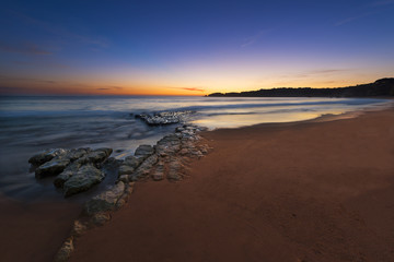 View of the Vau Beach (Praia do Vau) at sunset in Portimao, Algarve, Portugal; Concept for travel in Portugal and Algarve