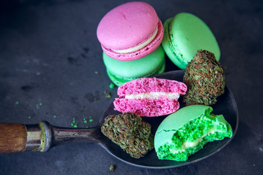 Eating Marijuana Edibles On Vintage Spoon With Cannabis Nugs On Dark Slate Background. Selective Focus With Copy Space.