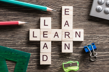 Conceptual business keywords on table with elements of game making crossword