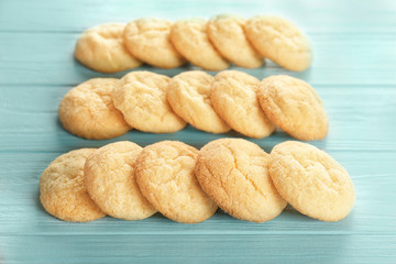 Tasty sugar cookies on wooden table